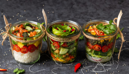 Poke salad with vegetables , salmon. avocado in a jar.Healthy food